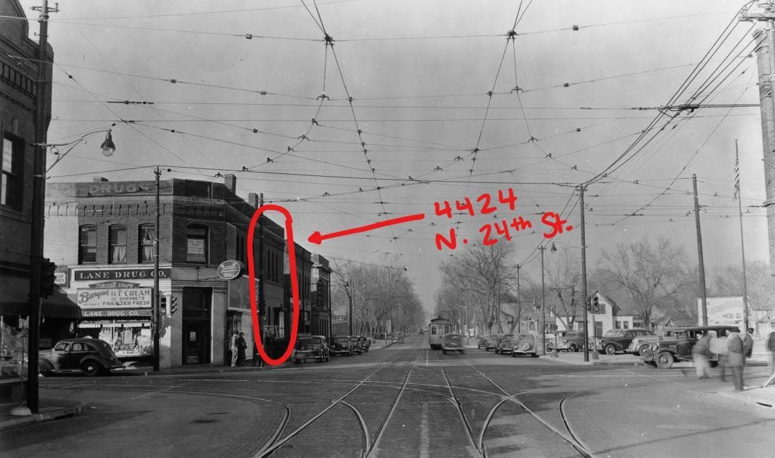 Vintage image of a street with cable car functionality and the facade of 4424 N 24th St